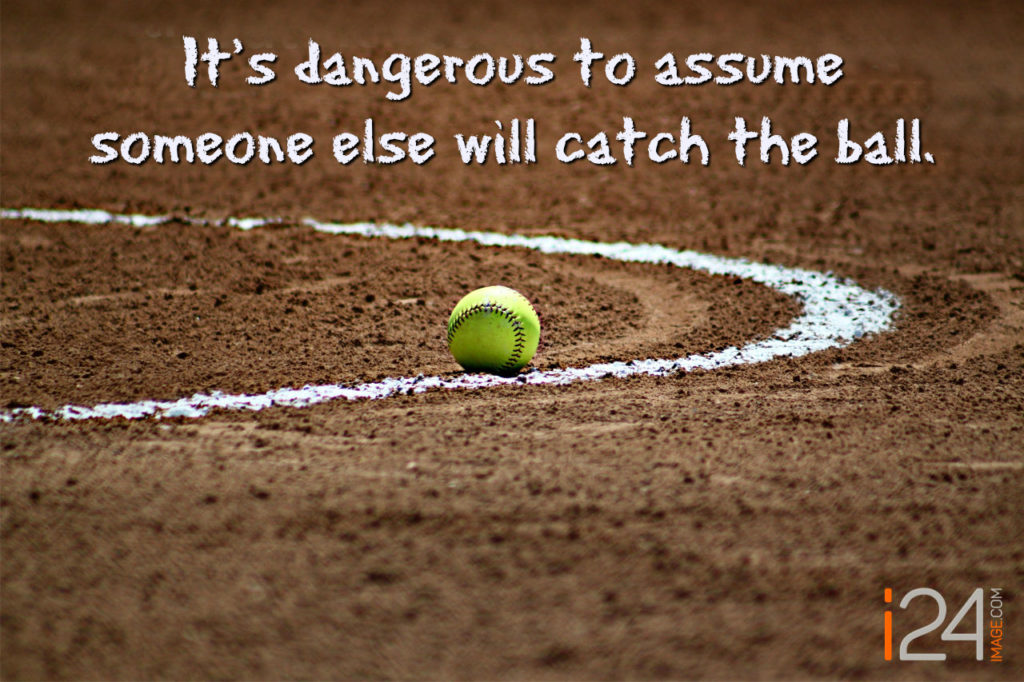 Photograph of a Baseball Laying on an Infield